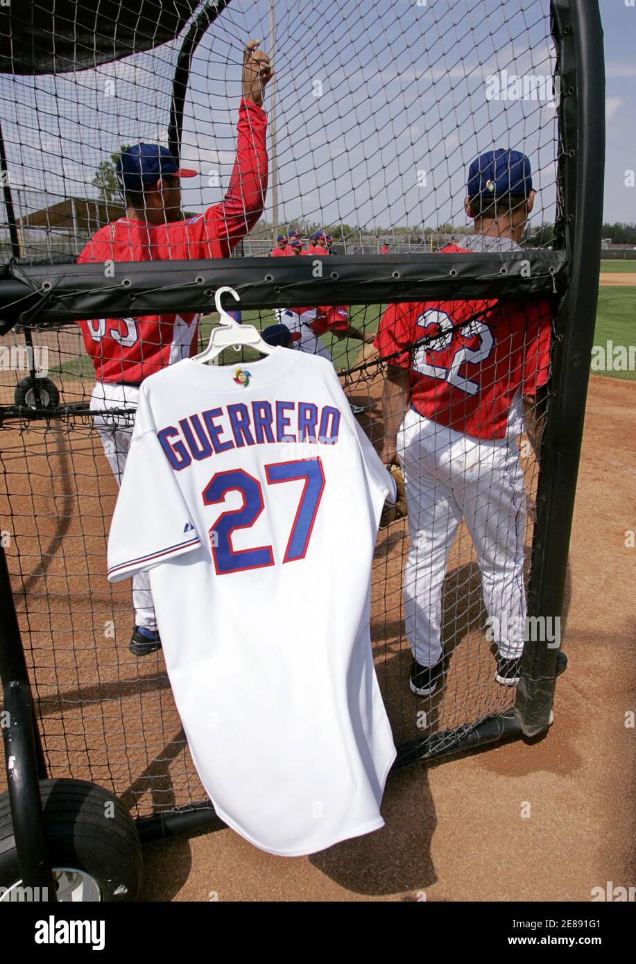 The game jersey of Dominican Republic National Team player Vladimir  Guerrero hangs on the batting cage as a tribute, during the team's first  workout for the upcoming World Baseball Classic at the