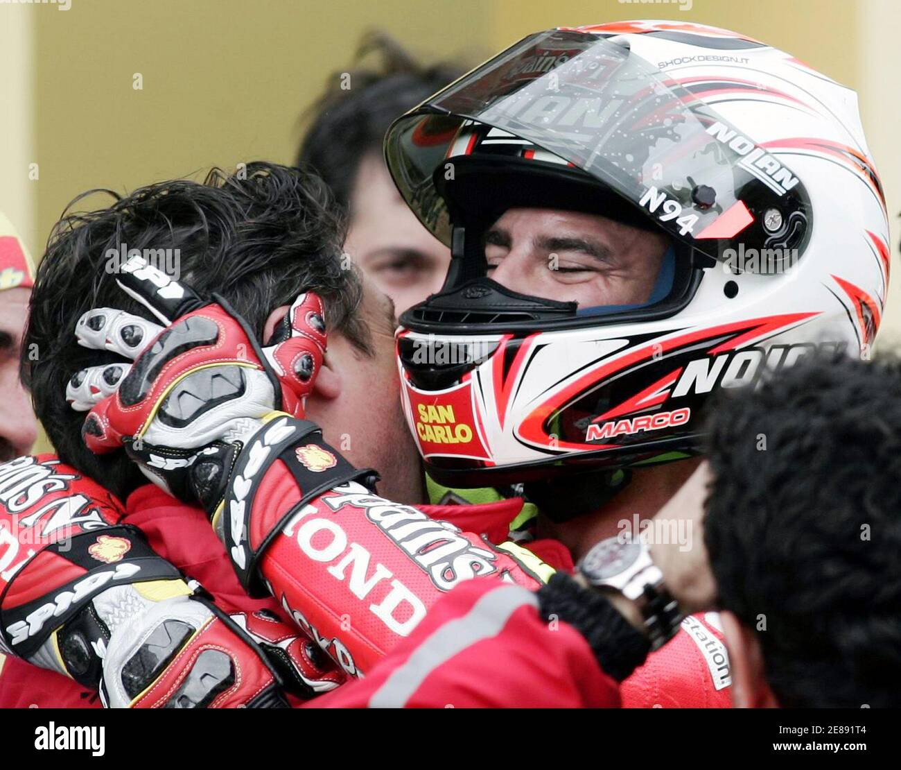 MotoGP rider Marco Melandri of Italy celebrates with his team members after  winning the Turkish Grand Prix in Istanbul Park in Istanbul April 30, 2006.  Melandri won the MotoGP Turkish Grand Prix