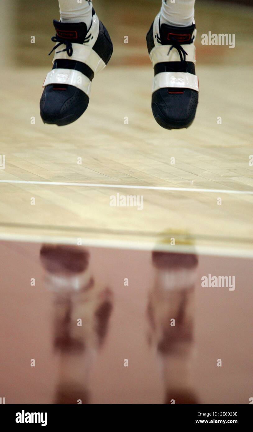 LeBron James' shoes leave the court as he practices his jump shot at morning practice during the first day of training camp for the USA men's Basketball team in Las Vegas, Nevada July 19, 2006. REUTERS/Mike Blake (UNITED STATES) Stock Photo
