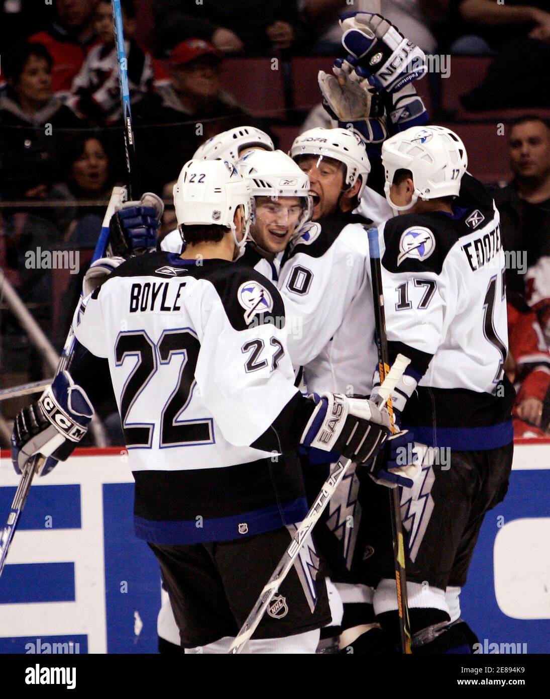 Tampa Bay Lightning players celebrate a third period goal by Vincent  Lecavalier (back L), that proved to be the game winning goal, against the  New Jersey Devils in Game 2 of their
