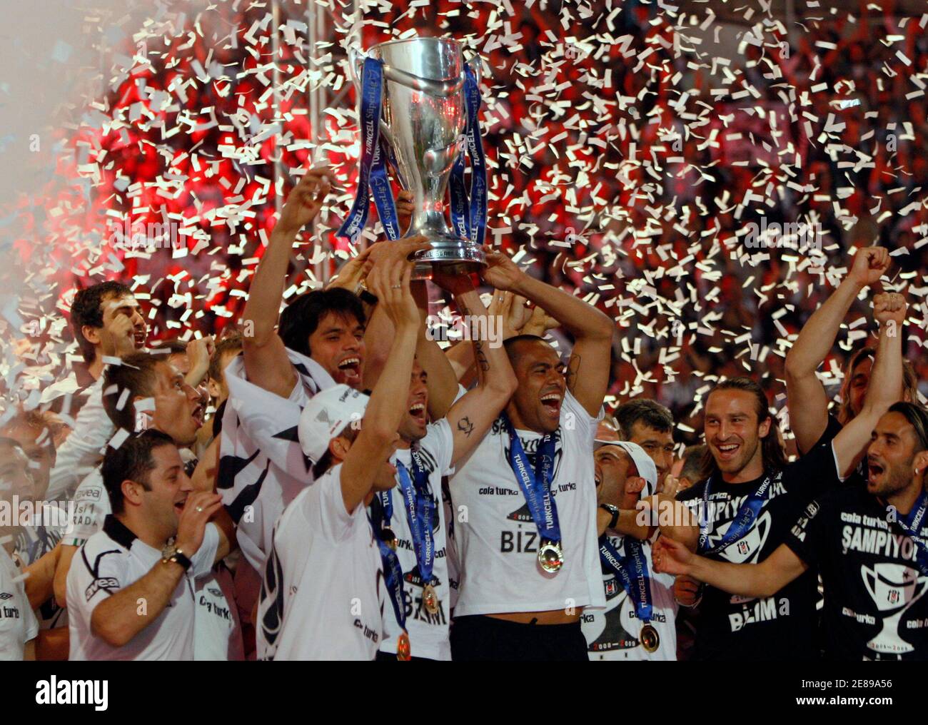 Besiktas players lift the Turkish Super League soccer championship trophy during a celebration at Inonu stadium in Istanbul May 31, 2009.REUTERS/Murad Sezer (TURKEY SPORT SOCCER) Stock Photo