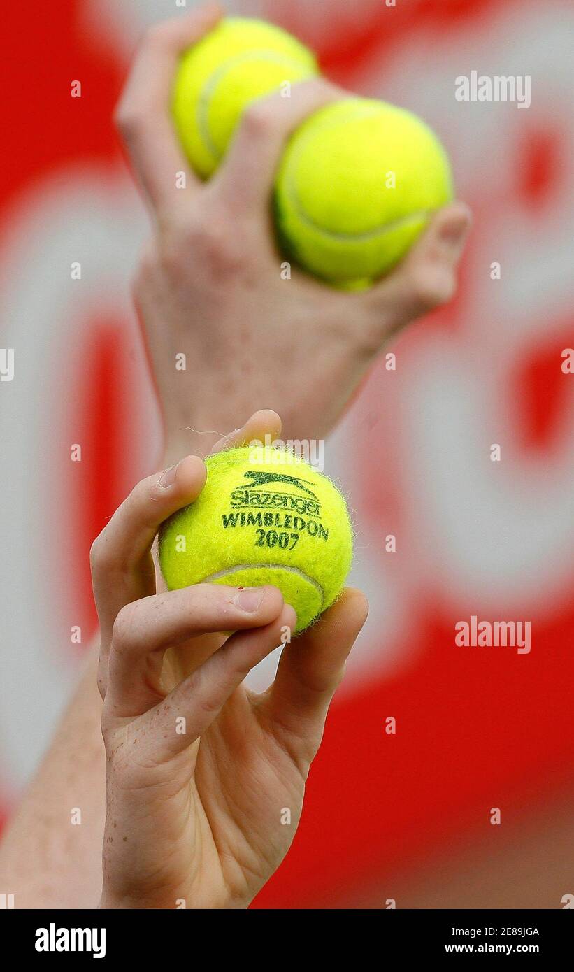 A ball boy holds balls during the final of the Nottingham Open tennis tournament in Nottingham, central England, June 23, 2007. REUTERS/Nigel Roddis (BRITAIN) Stock Photo