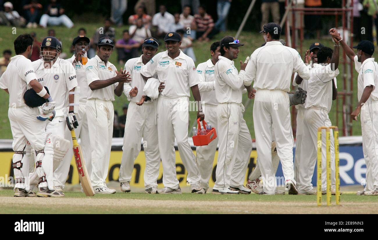 India's Sachin Tendulkar (2nd L) waits for the final decision from the third umpire after he was caught by Sri Lanka's Tillakaeatne Dilshan as Sri Lankan players celebrate during their first test cricket match in Colombo, July 26, 2008. Muttiah Muralitharan claimed 11-110 as Sri Lanka won the first test against India by an innings and 239 runs on Saturday. REUTERS/Anuruddha Lokuhapuarachchi (SRI LANKA) Stock Photo