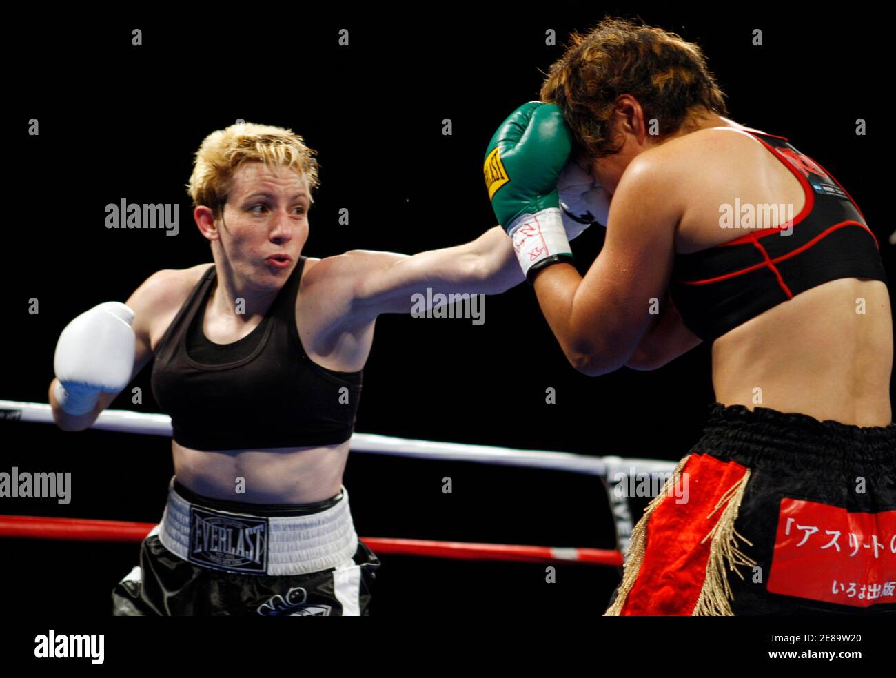 World Boxing Association (WBA)/Global Boxing Union (GBU) lightweight  champion Layla McCarter (L) of the U.S. jabs at Fujin Raika of Japan during  a 10-round title fight at the South Point hotel-casino in