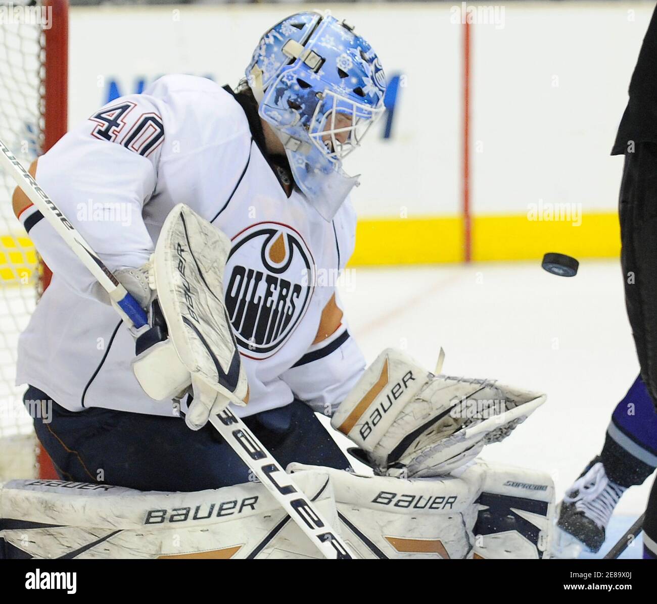Edmonton Oilers goaltender Devan Dubnyk blocks a shot during the second period of an NHL hockey game against the Los Angeles Kings in Los Angeles, California, April 10, 2010. The Oilers won 4-3. REUTERS/Gus Ruelas (UNITED STATES - Tags: SPORT ICE HOCKEY) Stock Photo