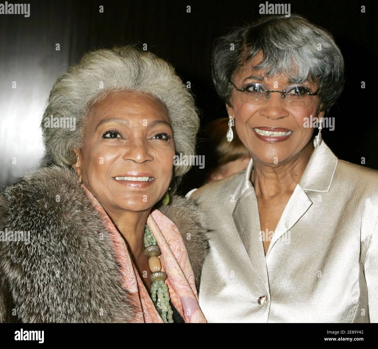 Singer Nancy Wilson (R) and actress Nichelle Nichols, best known for portraying Lieutenant Uhura on Star Trek pose as they arrive at the [David Gest] gala titled 'THE Party' in Beverly Hills October 17, 2005. [Gest, a producer, held the gala to celebrate the launch of his new Hollywood based firm 'Extreme Entertaintment Enterprises' which is set to produce a television special in 2006 titled 'Dionne Warwick 45th Anniversary Spectacular.'] Stock Photo
