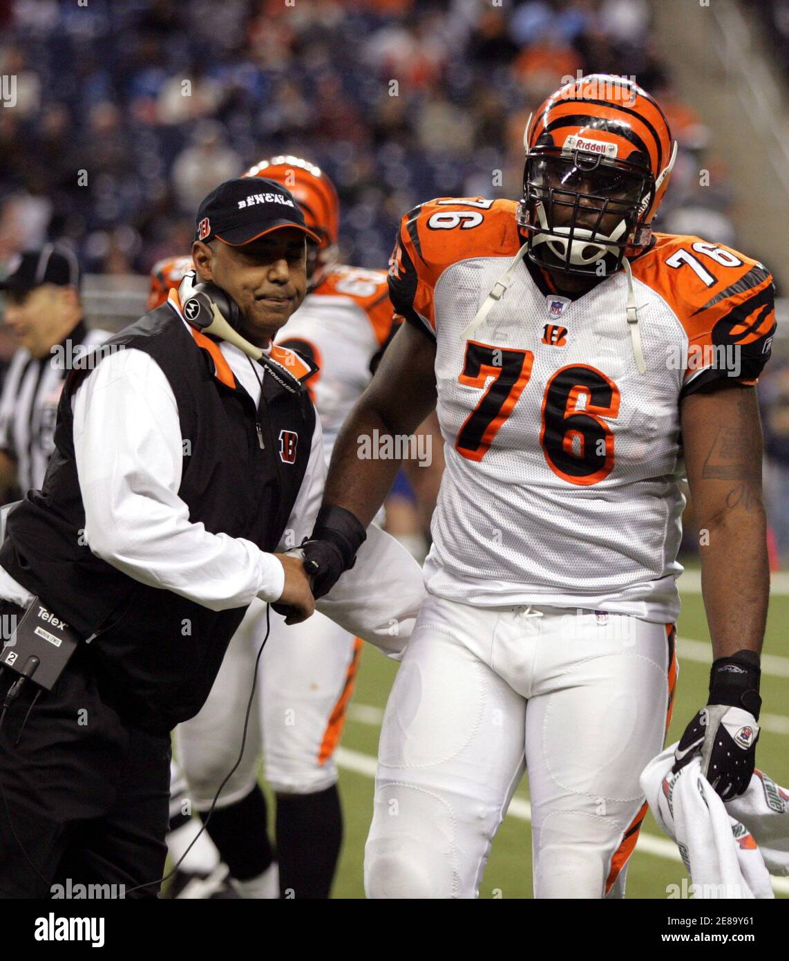 Cincinnati Bengals head coach Marvin Lewis (L) greets tightend Levi Jones  (76) as Jones heads back to the bench during the second half of their NFL  game against the Detroit Lions in