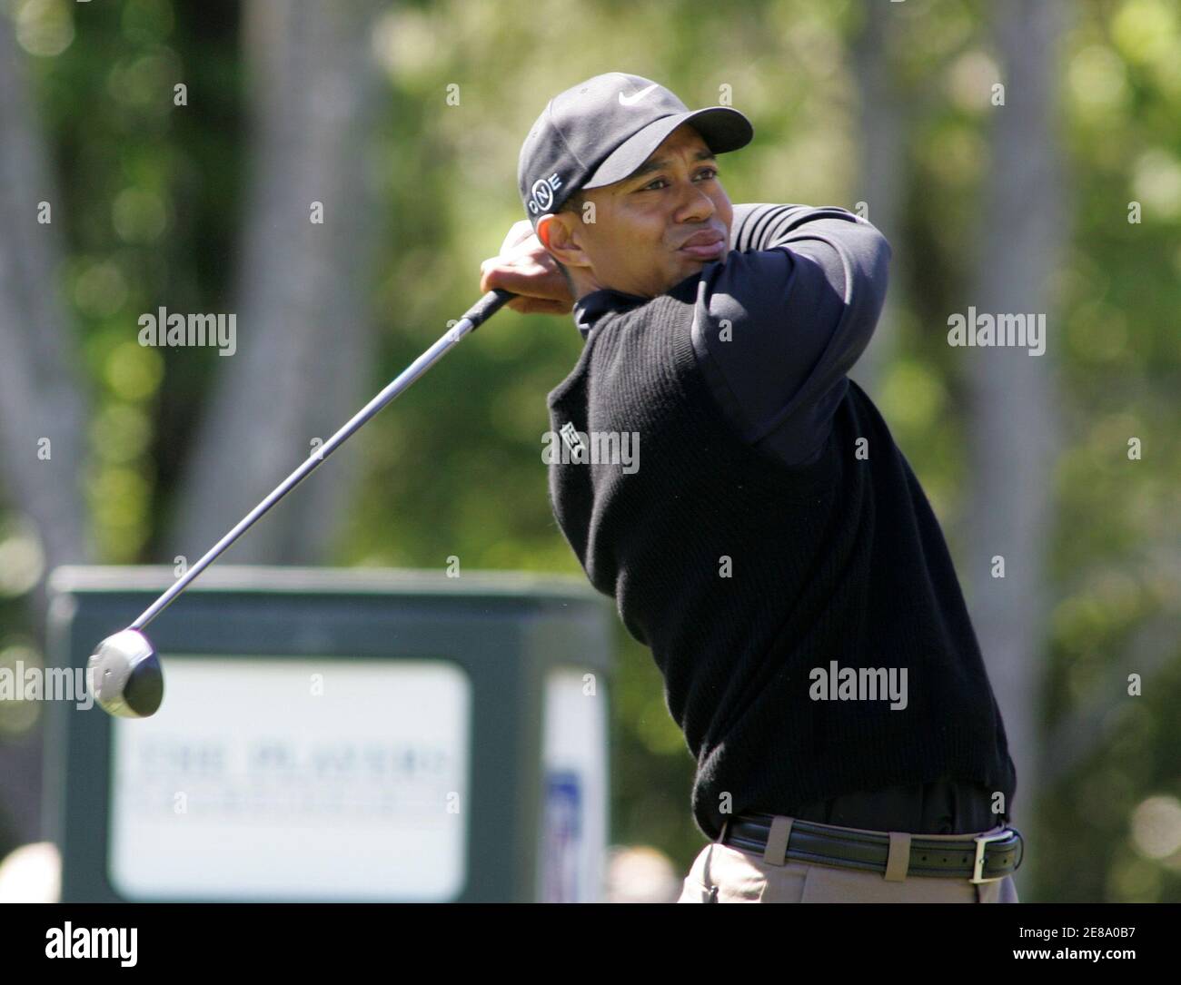 Tiger Woods of the United States tees off on the seventh hole during the third round at the Players Championship golf tournament in Ponte Vedra Beach, Florida on March 25, 2006. REUTERS/Rick Fowler Stock Photo