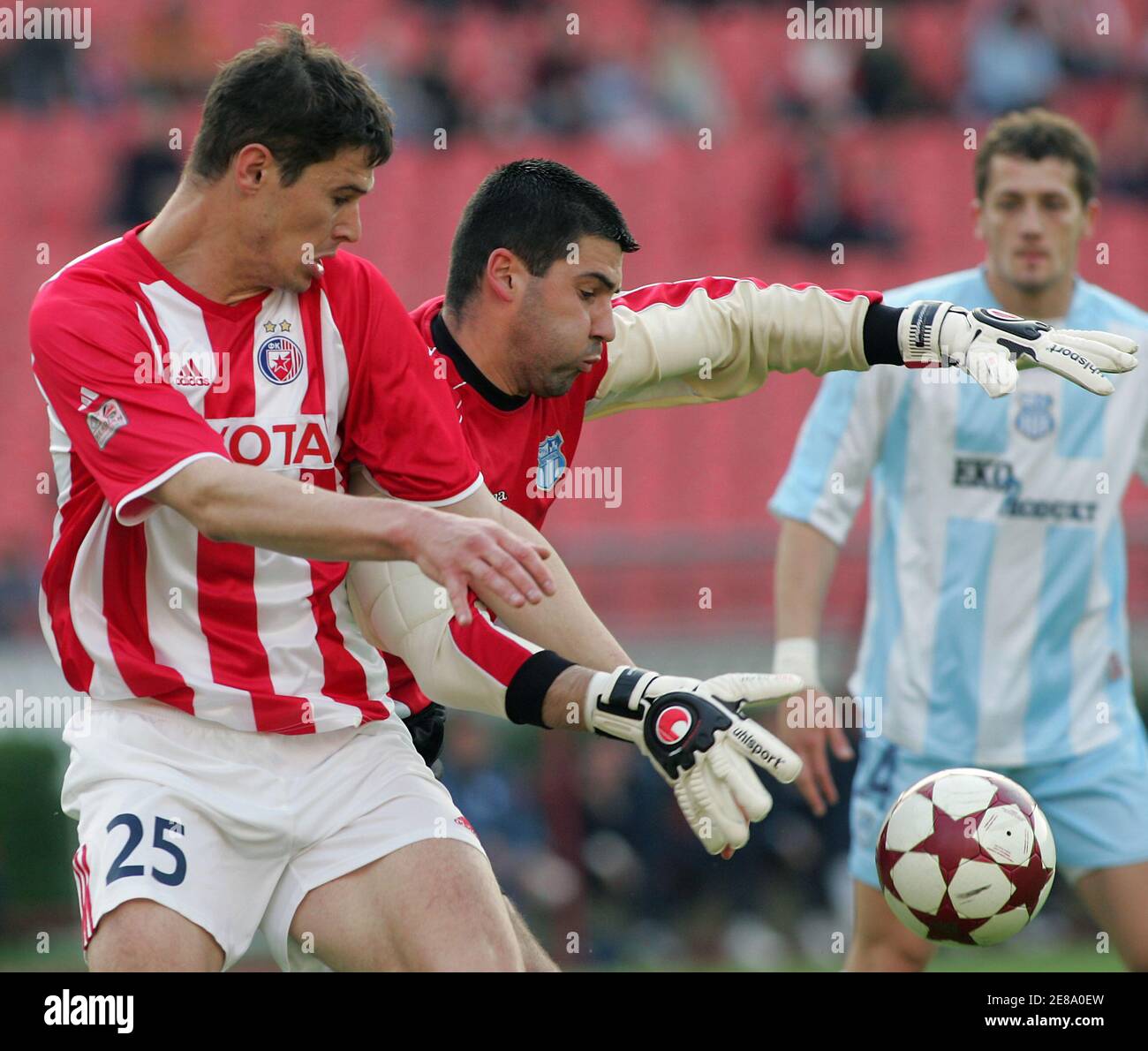 Red Star's Nikola Zigic (L) struggles for the ball with Nenad Eric of OFK Beograd during their soccer match in Belgrade April 22, 2006. Red Star beat OFK Beograd 2-0. Djokic scored two goals. REUTERS/Ivan Milutinovic Stock Photo