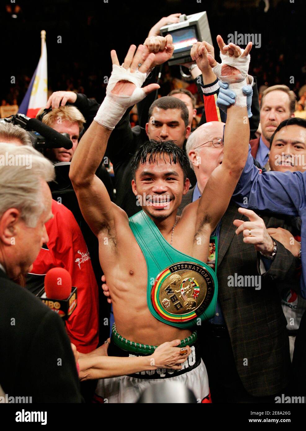 Super featherweight boxer Manny Pacquiao of Cebu City, Philippines, celebrates his win over Erik Morales of Tijuana, Mexico, at the Thomas & Mack Center in Las Vegas Nevada January 21, 2006. Pacquiao won the fight with a 10th round TKO. REUTERS/Steve Marcus Stock Photo