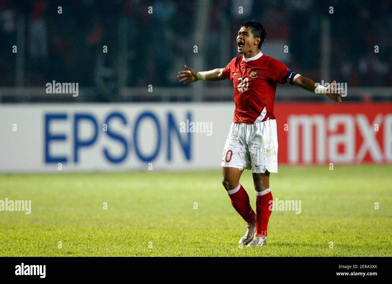 Indonesia's Bambang Pamungkas reacts after Indonesia won against Bahrain after their 2007 AFC Asian Cup Group D soccer match in Jakarta July 10, 2007. REUTERS/Beawiharta (INDONESIA) Stock Photo