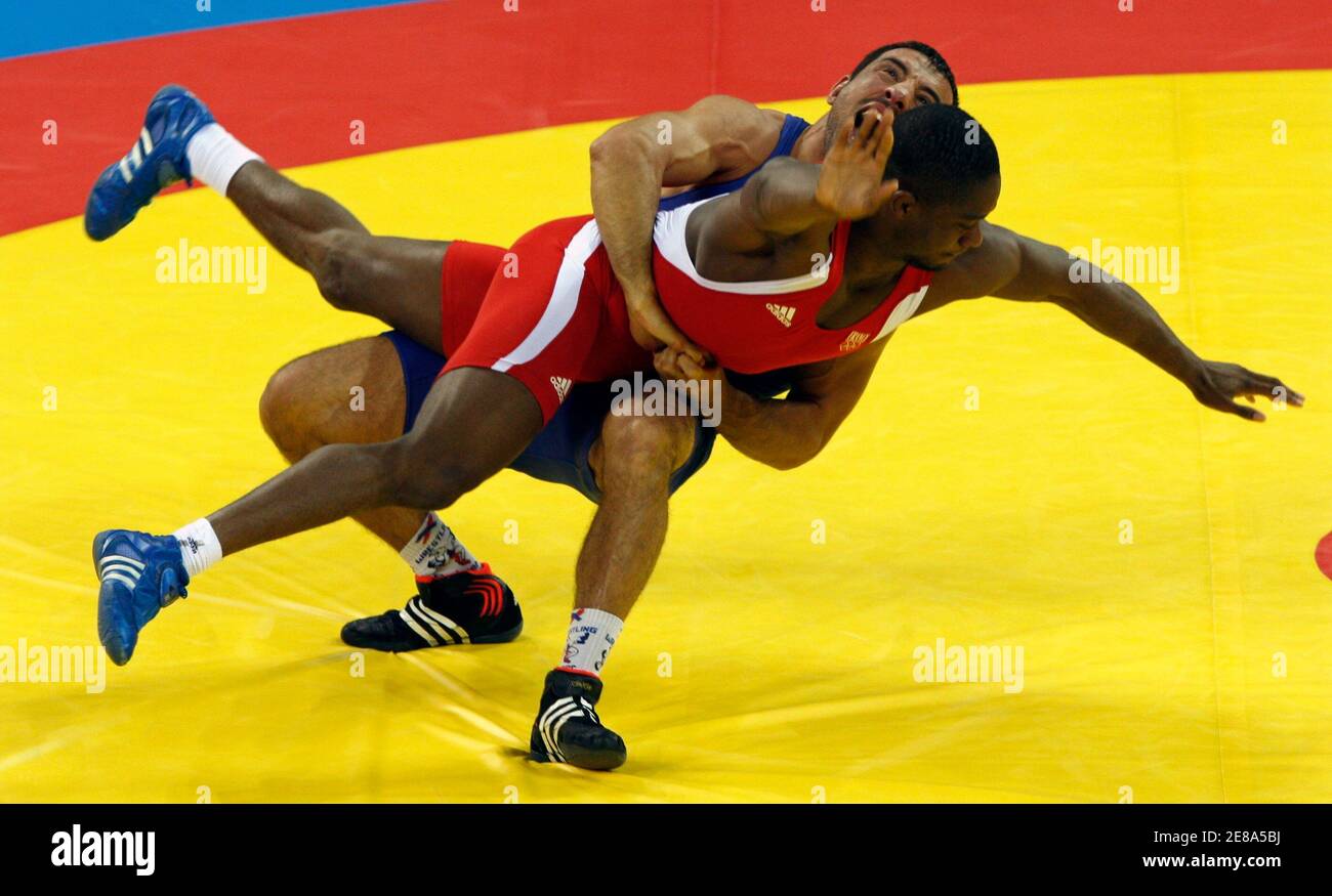 Melonin Noumonvi of France (in red) fights Ara Abrahamian of Sweden during  the men's 84kg bronze medal Greco-Roman wrestling competition at the  Beijing 2008 Olympic Games August 14, 2008. REUTERS/Oleg Popov (CHINA