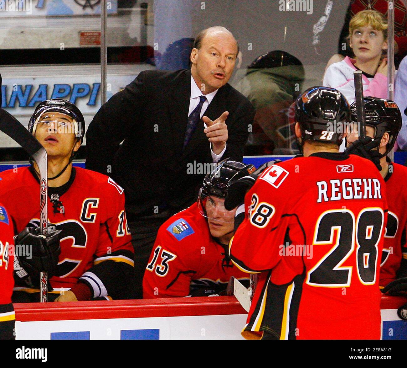 Calgary Flames head coach Mike Keenan (C) gives out last minute  instructions to his team during the third period of his NHL hockey game  against the Nashville Predators in Calgary, Alberta, January