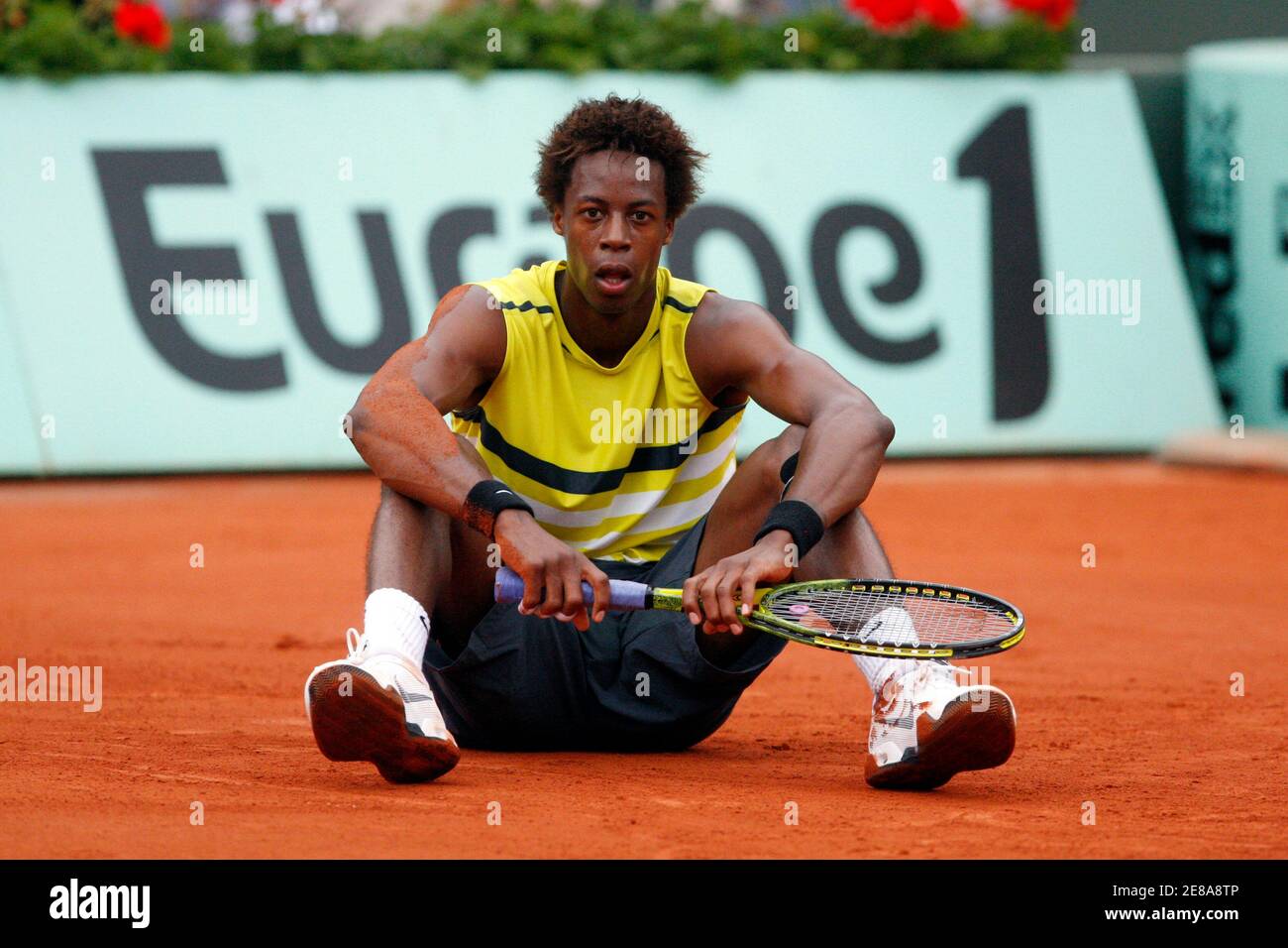 Gael Monfils of France sits on the court during his match against Victor  Crivoi of Romania at the French Open tennis tournament at Roland Garros in  Paris May 28, 2009. REUTERS/Vincent Kessler (