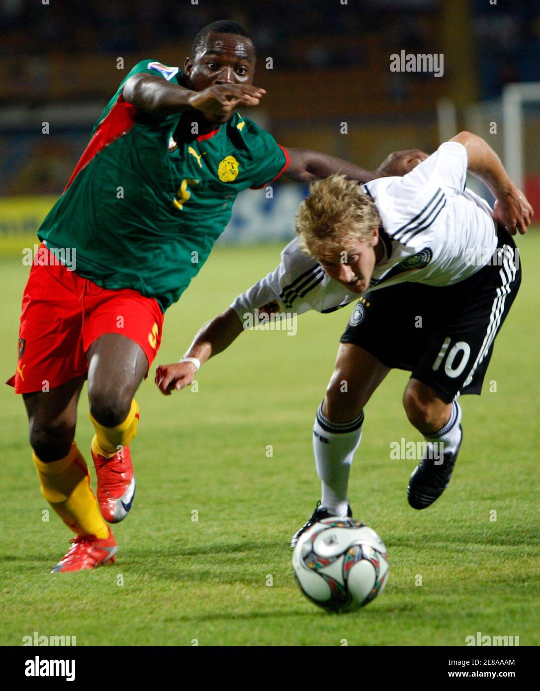 Lewis Holtby of Germany (R) is challenged by Enow Tabot of Cameroon (L) during their FIFA U-20 World Cup group C soccer match in Ismailia October 2, 2009. REUTERS/Goran Tomasevic (EGYPT SPORT SOCCER) Stock Photo