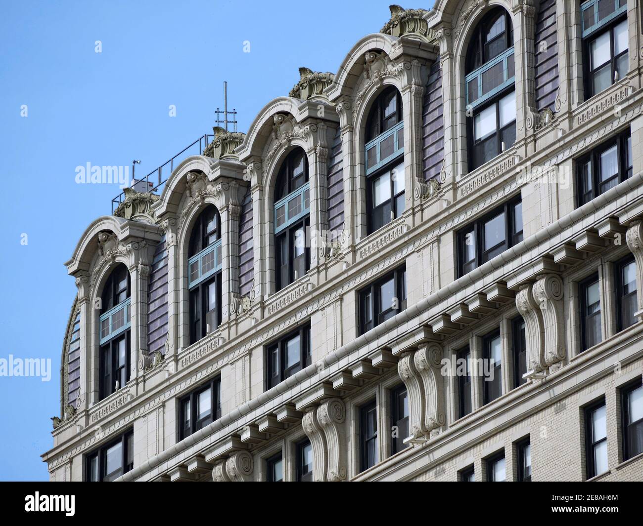 Close-up view of baroque ornamentation at the top of an old luxury apartment building Stock Photo
