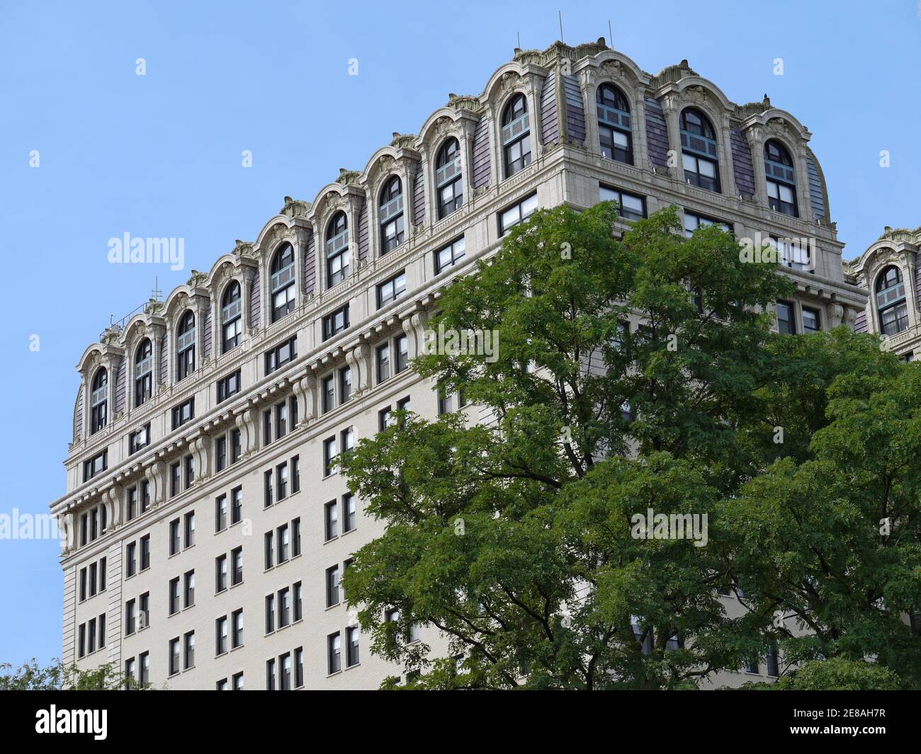 Close-up view of baroque ornamentation at the top of an old luxury apartment building Stock Photo
