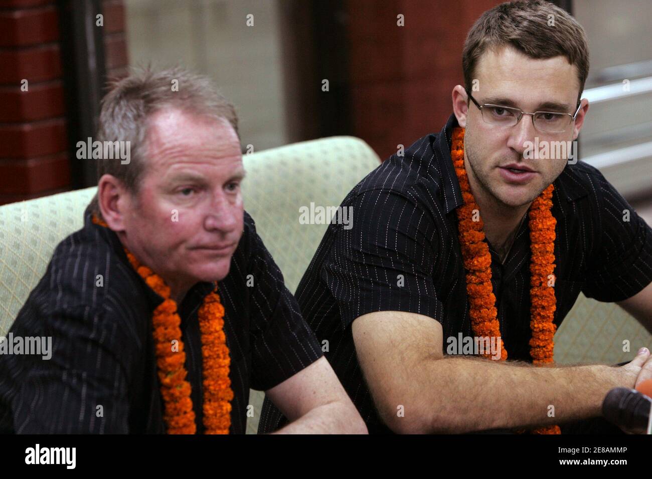 New Zealand cricket team captain Daniel Vettori (R) talks to press next to his team manager Lindsay Crocker at Zia International Airport in Dhaka, September 30, 2008. The New Zealand cricket team will play three one-day internationals and two test matches against Bangladesh on October 9 at the Sher-e-Bangla National Stadium in Mirpur . REUTERS/Andrew Biraj (BANGLADESH) Stock Photo