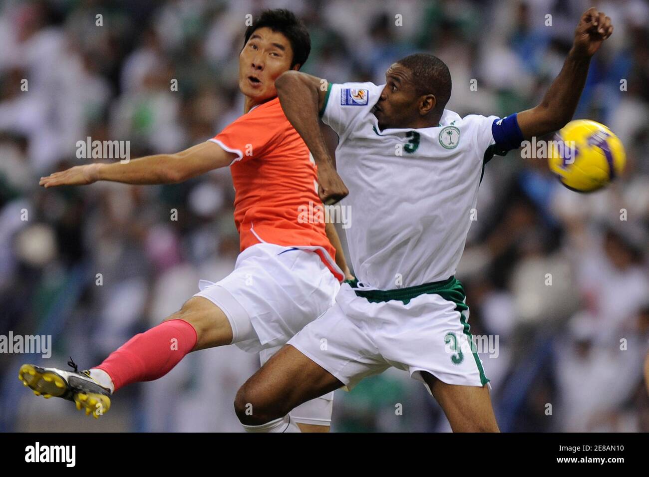 Saudi's Reda Fallatah (R) fights with South Korea's SH Jeong for the ball during their World Cup qualifying soccer match in Riyadh November 19, 2008.  REUTERS/Fahad Shadeed (SAUDI ARABIA) Stock Photo