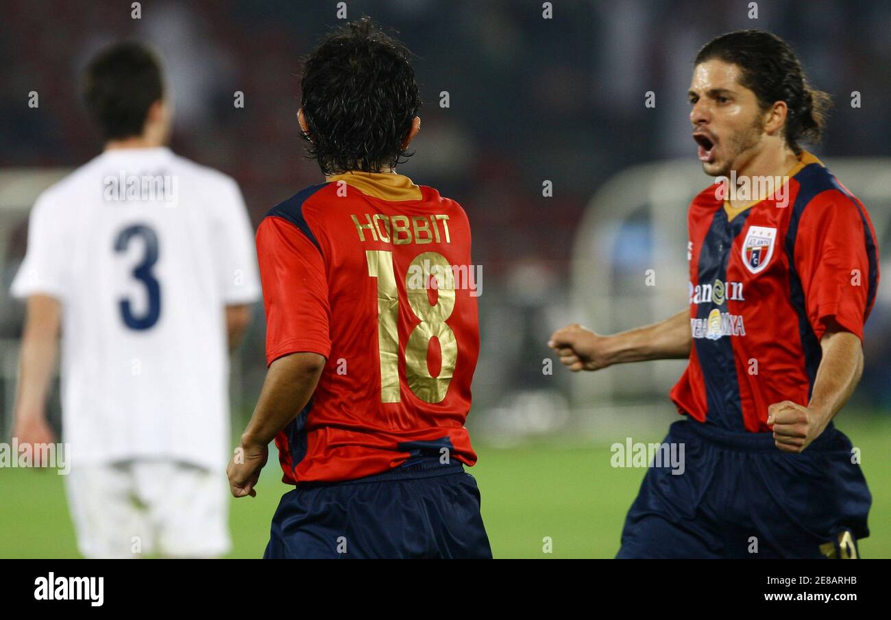 Atlante's Christian Bermudez celebrates his goal with teammate Guillermo Rojas (R) during their FIFA Club World Cup quarter-final soccer match against Auckland City at Zayed Sports City stadium in Abu Dhabi December 12, 2009. REUTERS/Fahad Shadeed (UNITED ARAB EMIRATES - Tags: SPORT SOCCER) Stock Photo