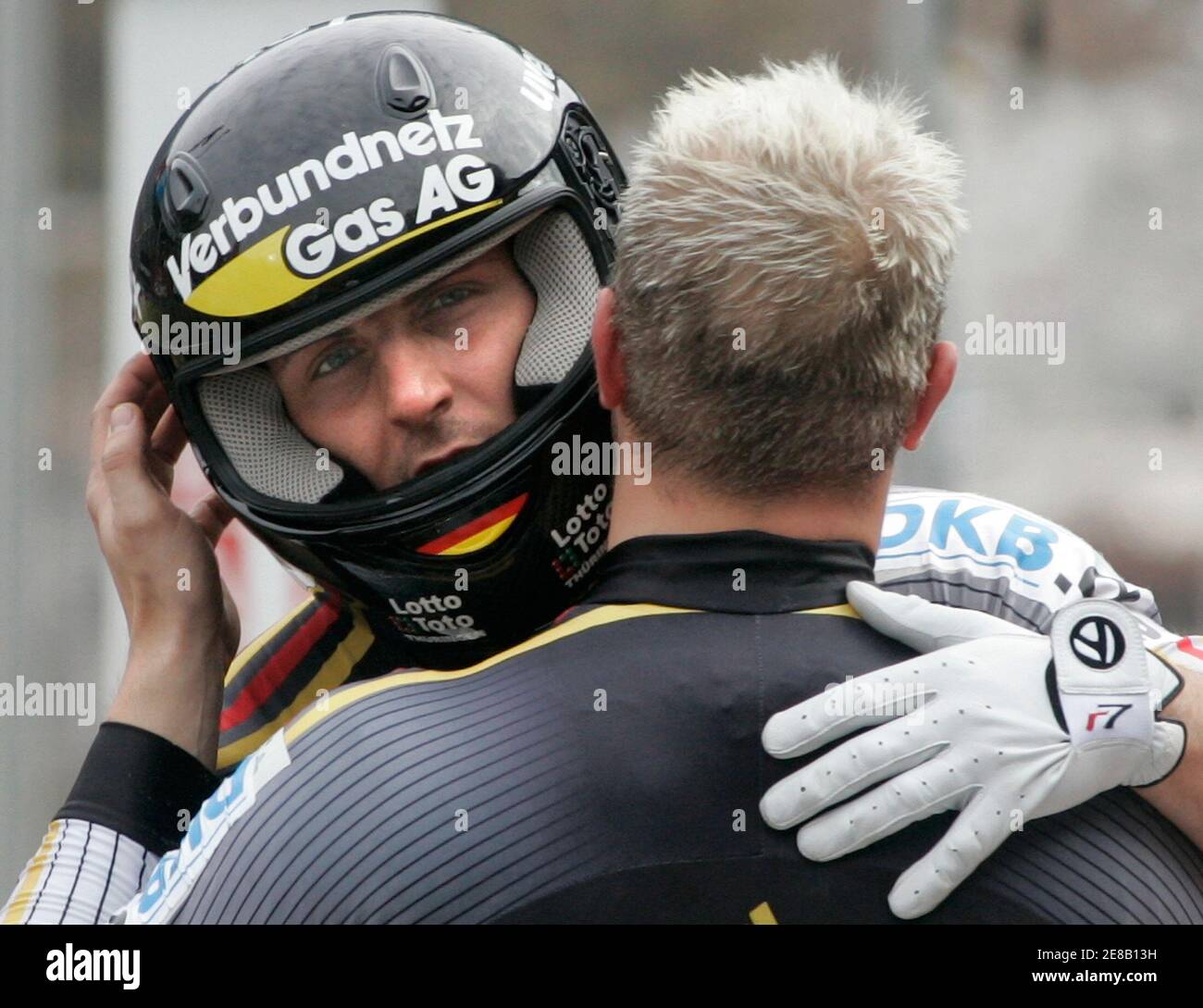 Team Germany 1 with Andre Lange (R) and Kevin Kuske celebrate their victory of the bobsleigh World Cup final race in the southern Bavarian resort of Koenigssee, February 23, 2007. Team Germany 1 won the race ahead of Team Germany 2 with Matthias Hoepfner and Andreas Porth and Team Canada 1 with Pierre Luders and David Bissett.   REUTERS/Alexandra Beier (GERMANY) Stock Photo