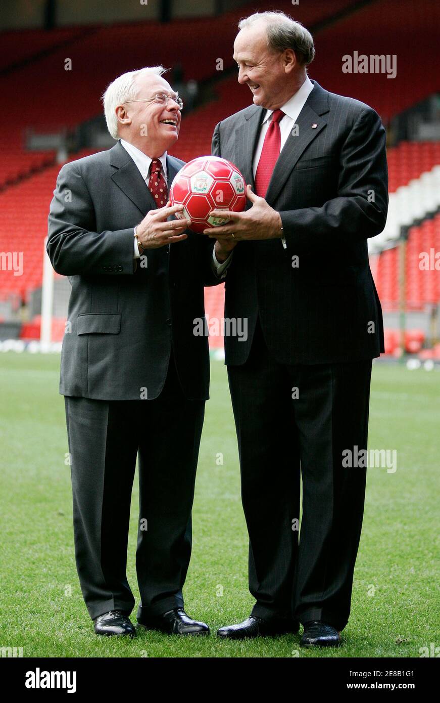 Liverpool Football Club's new owners George Gillett (L) and Tom Hicks pose  for photographers in front of the club's Kop stand at Anfield in Liverpool,  northern England February 6, 2007. English Premier