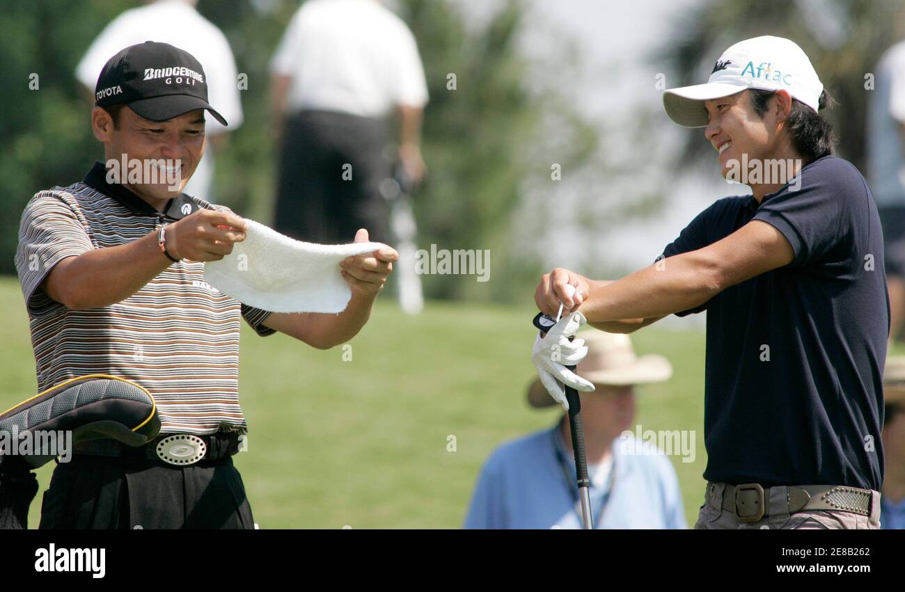 Shigeki Maruyama (L) and Ryuji Imada (R) of Japan share a laugh while waiting to tee off on the 16th hole during the second round of play at The Players Championship golf tournament in Ponte Vedra Beach, Florida on May 11, 2007. REUTERS/Rick Fowler (UNITED STATES) Stock Photo