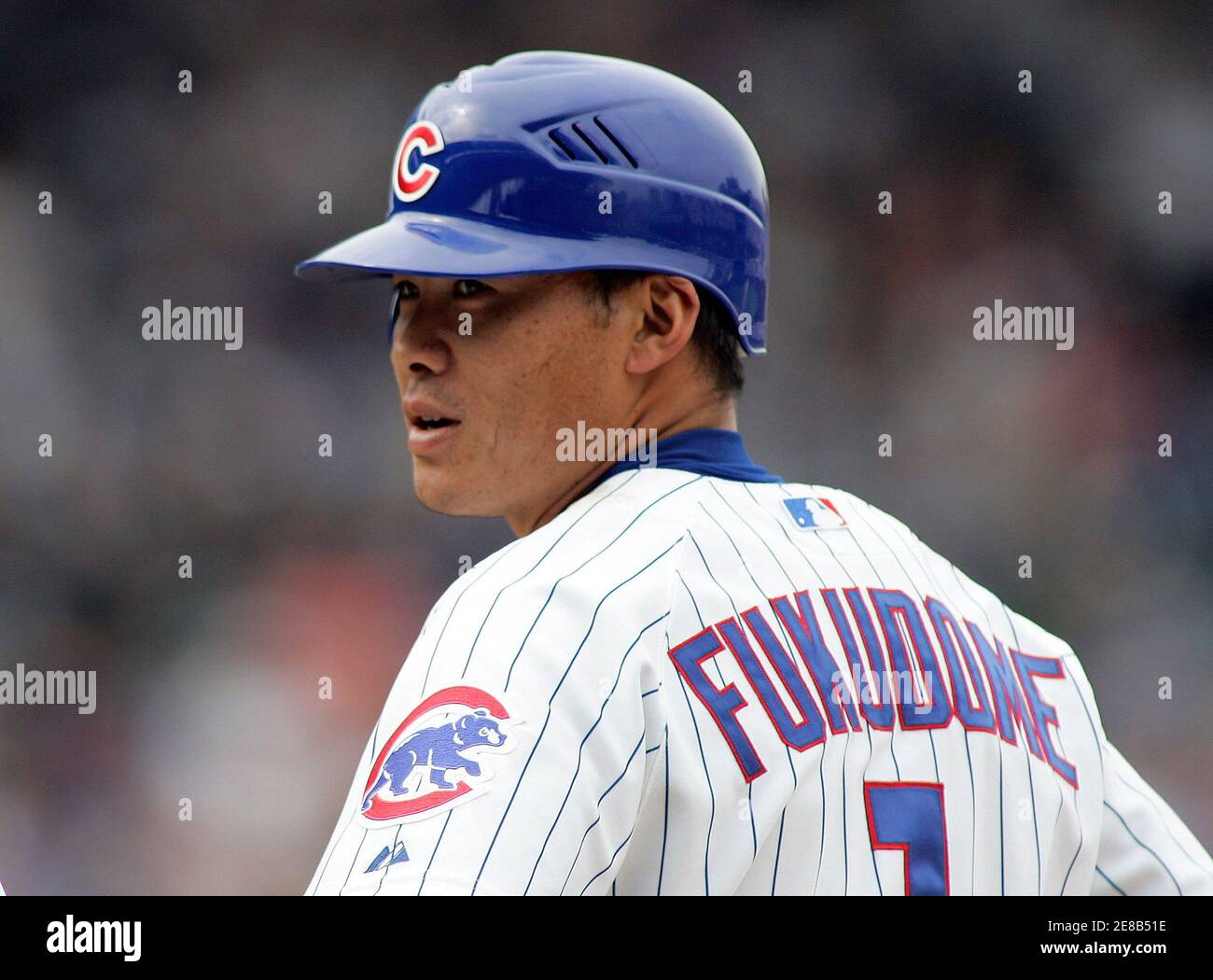 Chicago Cubs player Kosuke Fukudome looks toward first base coach Matt  Sinatro after hitting a single in the second inning of their National  League baseball game against the New York Mets in