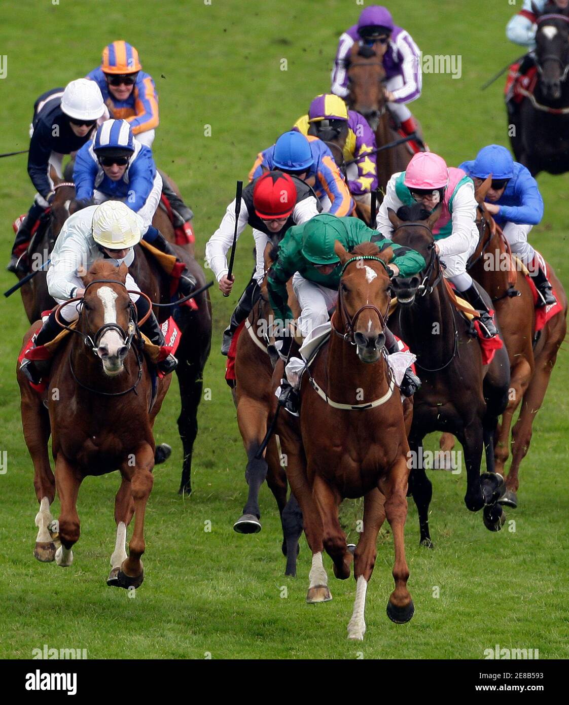 Winning rider Kevin Manning on New Approach (R) leads field in the Derby during the Epsom Derby Festival at Epsom Downs in Surrey, southern England June 7, 2008.    REUTERS/Darren Staples   (BRITAIN) Stock Photo