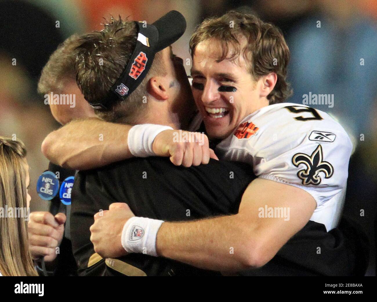 Quarterback Drew Brees hugs New Orleans Saints head coach Sean Payton after  winning the NFL's Super Bowl XLIV football game in Miami, Florida, February  7, 2010. REUTERS/Pierre Ducharme (UNITED STATES Stock Photo -