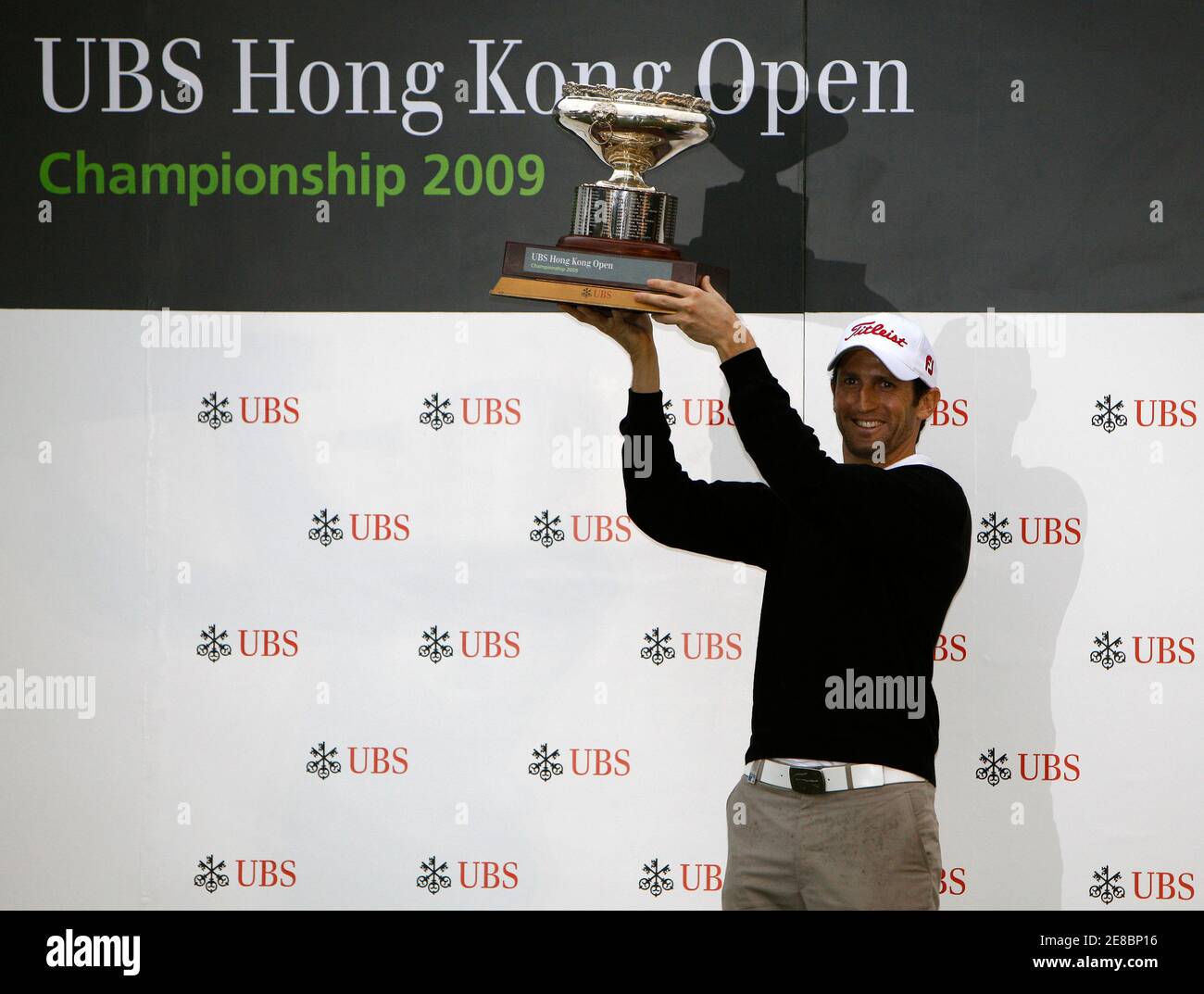Gregory Bourdy of France celebrates with the winner's trophy after winning the Hong Kong Open golf tournament November 15, 2009.     REUTERS/Tyrone Siu    (CHINA SPORT GOLF) Stock Photo