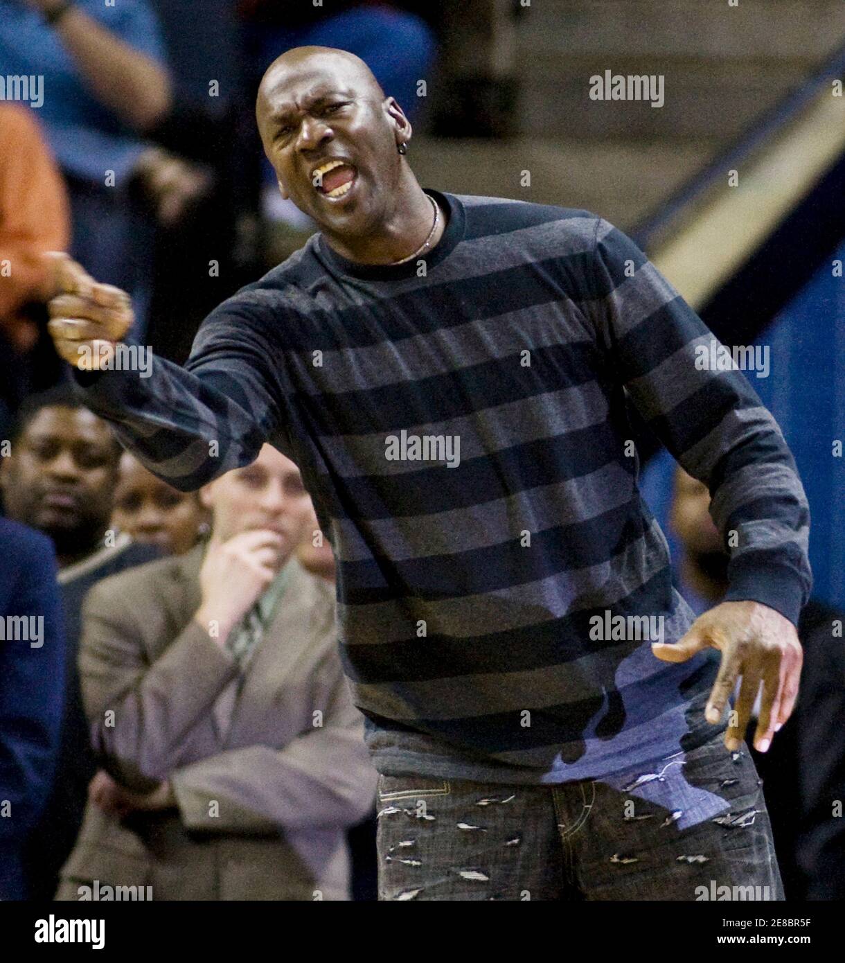 Charlotte Bobcats team owner Michael Jordan yells at the officials against  the Toronto Raptors in the second half during an NBA basketball game in  Charlotte, North Carolina March 29, 2010. REUTERS/Chris Keane (