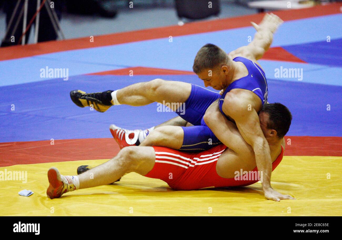 Marek Svec of the Czech Republic (top) wrestles with Tsimafei Dzeinichenka  of Belarus in the Greco-Roman wrestling 96 kg weight class during the  European Championship in Vilnius April 5, 2009. REUTERS/Ints Kalnins (