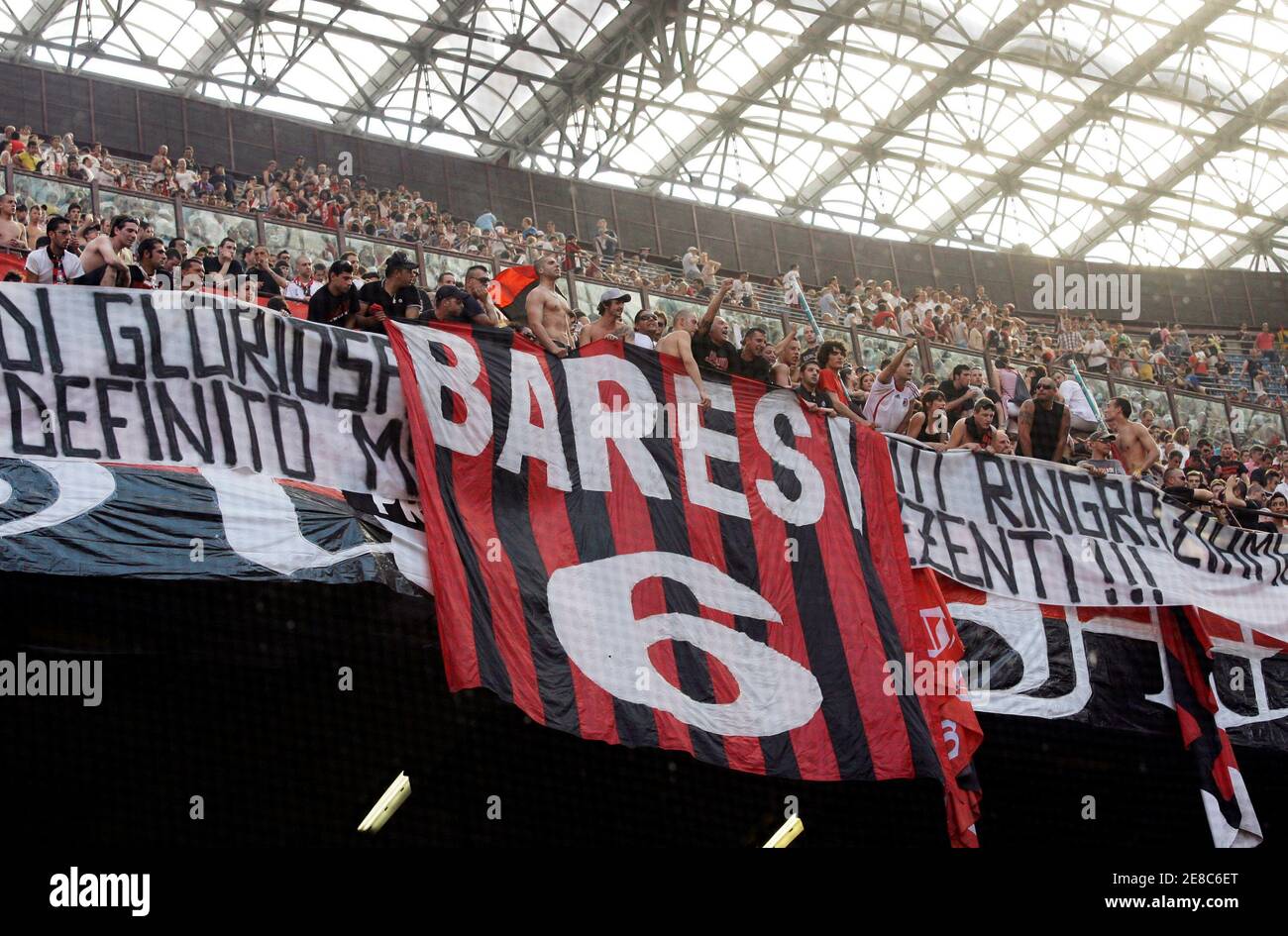 AC Milan's supporters display a banner with the name of AC Milan's former  player Franco Baresi at the end of the Italian Serie A soccer match against  AS Roma at the San