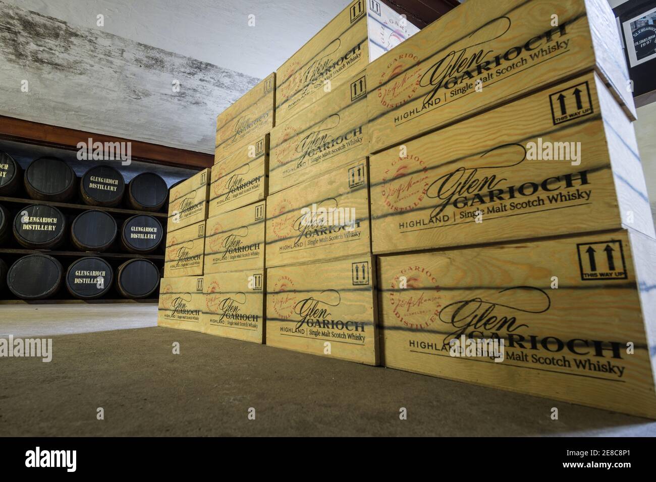 Whisky barrels and crates in the warehouse at Glen Garioch distillery, near Inverurie, Aberdeenshire, Scotland Stock Photo