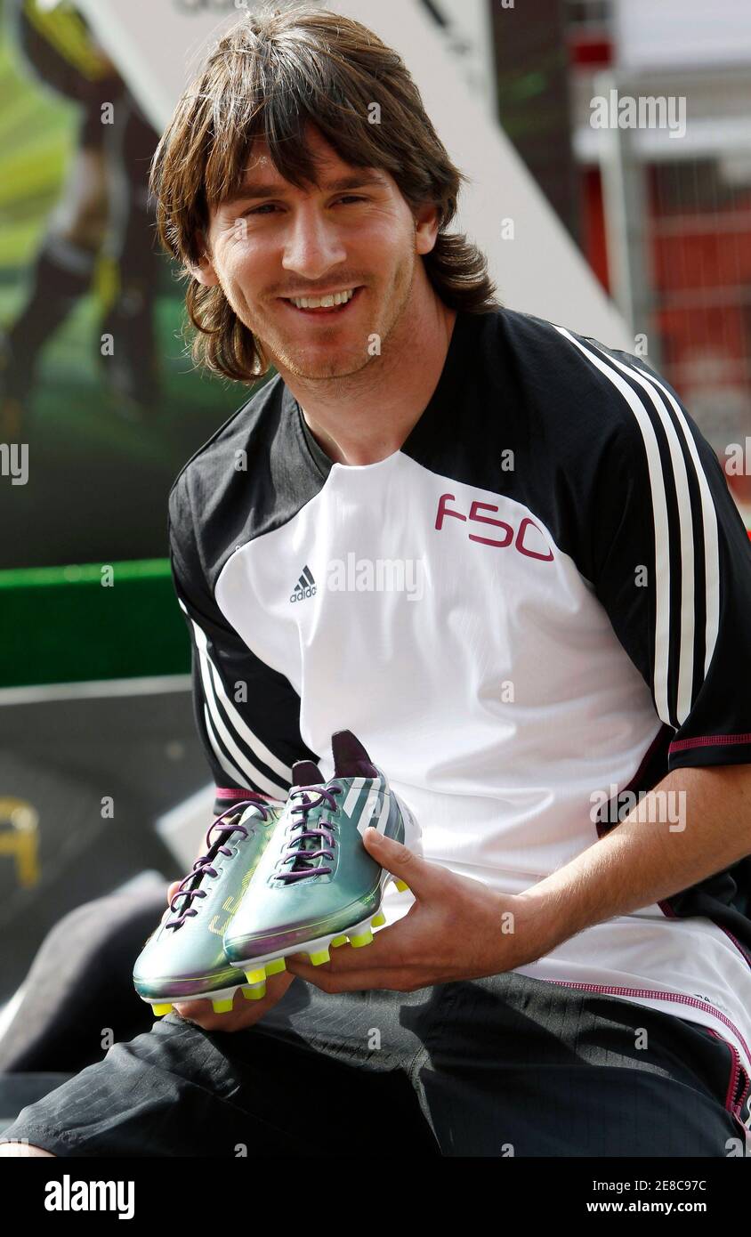 Argentina's national soccer team player Lionel Messi displays the new F50  adiZero soccer boots during a promotional event at Montmelo circuit near  Barcelona May 11, 2010. The boots, weighing only 165 grams,
