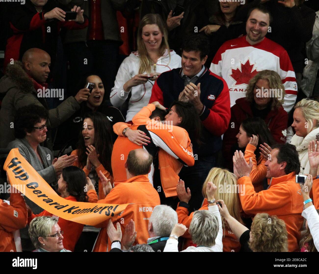 Sven Kramer of the Netherlands hugs his girlfriend Naomi van As after  winning the gold medal in the men's 5000 meters speed skating race at the  Richmond Olympic Oval during the Vancouver