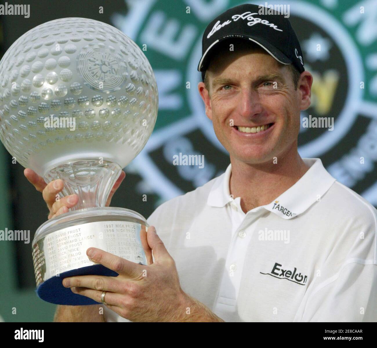 Jim Furyk of the U.S. holds his trophy after winning the Sun City Golf Challenge in Sun City, west of Johannesburg, in South Africa December 4, 2005. Furyk chipped in on the second extra hole of a sudden-death playoff to win the 25th Sun City Golf Challenge on Sunday. Furyk's birdie from 15-feet from the back of the par-four 18th green beat off Briton Darren Clarke and Australia's Adam Scott for the $1.2 million first prize. REUTERS/Juda Ngwenya Stock Photo