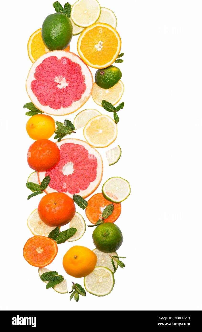 Citrus background. Fresh citrus fruits - Lemons, oranges, limes, grapefruits On wooden background Stock Photo