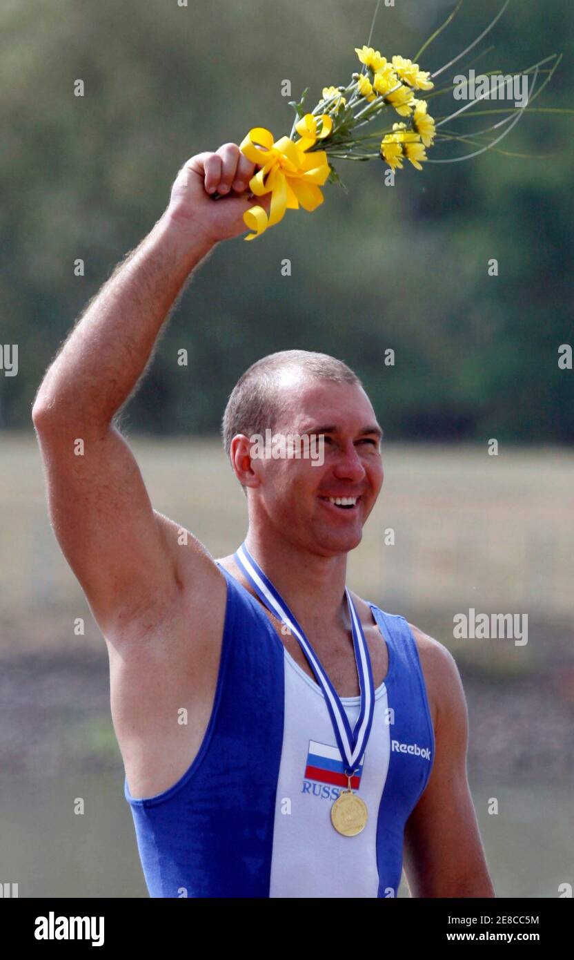 Maxim Opalev of Russia celebrates his victory during the award ceremony of the C1 Men 500m race at the European Flatwater Championships in the central Bohemian village of Racice, Czech Republic, July 9, 2006.   REUTERS/Petr Josek   (Czech Republic) Stock Photo