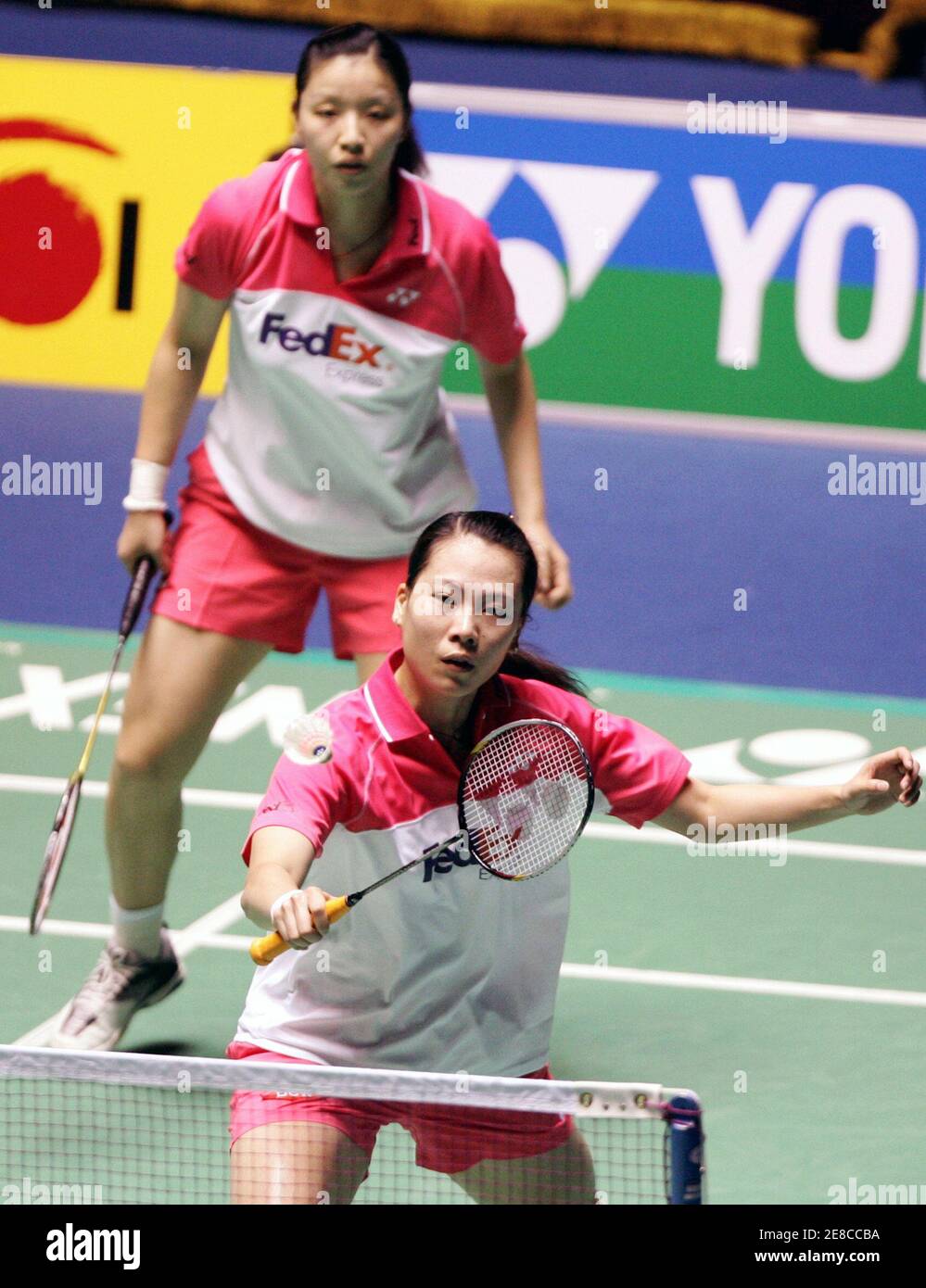 Zhang Jiewen (front) of China returns the shuttlecock as compatriot Yang  Wei looks on during their women's doubles final against Indonesia's Jo  Novita and Gresya Polii at the Yonex Korea Open Badminton
