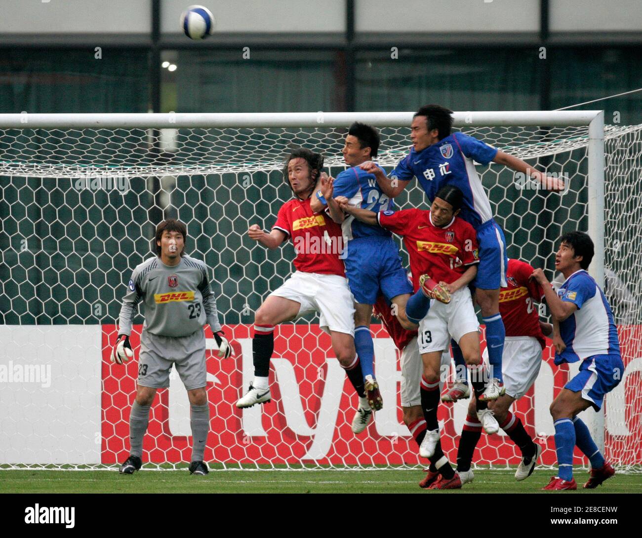 Shanghai Shenhua and Urawa Reds players jump for the ball next to the Reds  goal during their AFC Champions League 2007 soccer match in Shanghai April  25, 2007. REUTERS/Aly Song (CHINA Stock