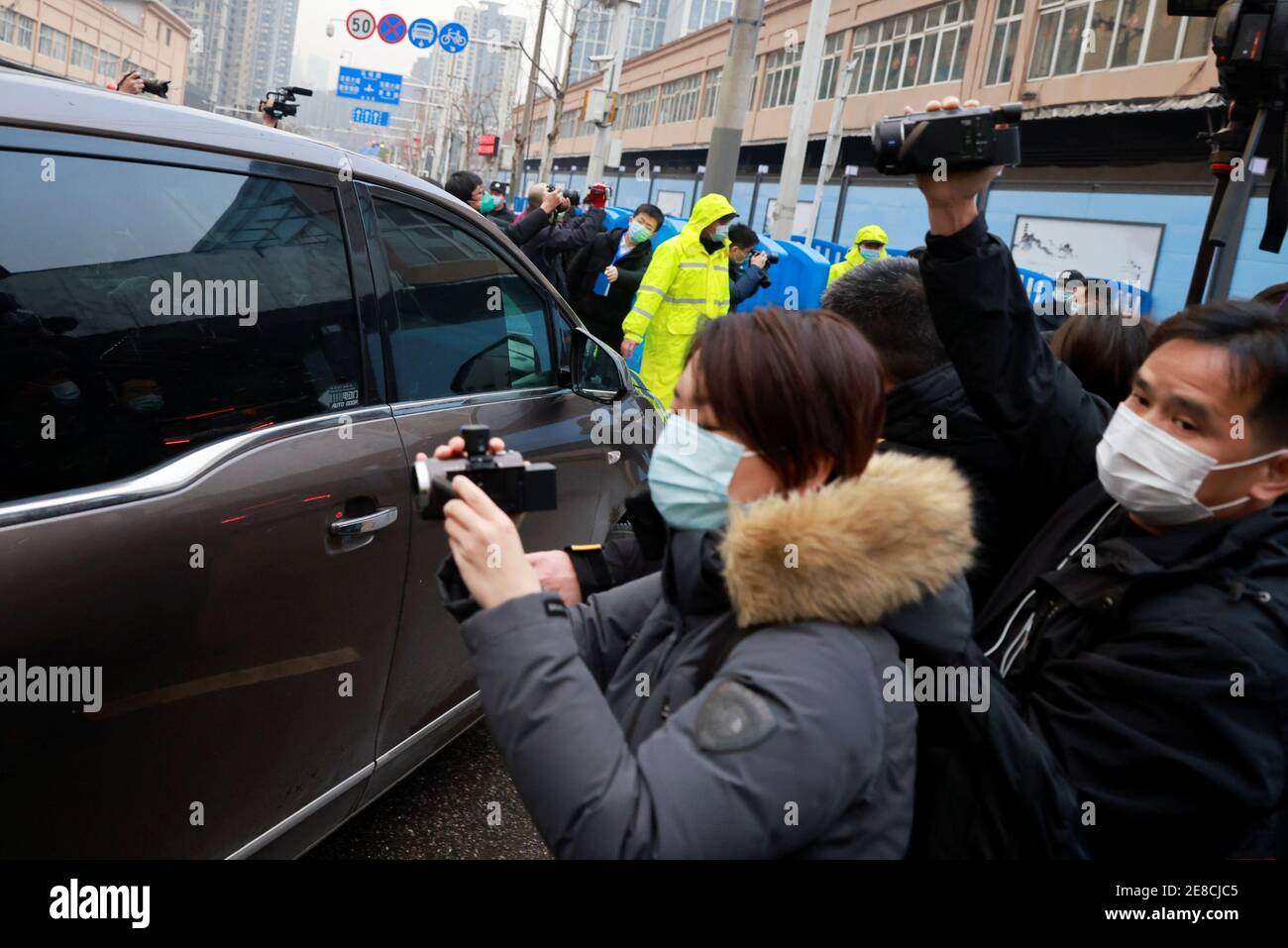 A car carrying members of the World Health Organization (WHO) team tasked with investigating the origins of the coronavirus disease (COVID-19) arrives at Huanan seafood market in Wuhan, Hubei province, China January 31, 2021. REUTERS/Thomas Peter Stock Photo