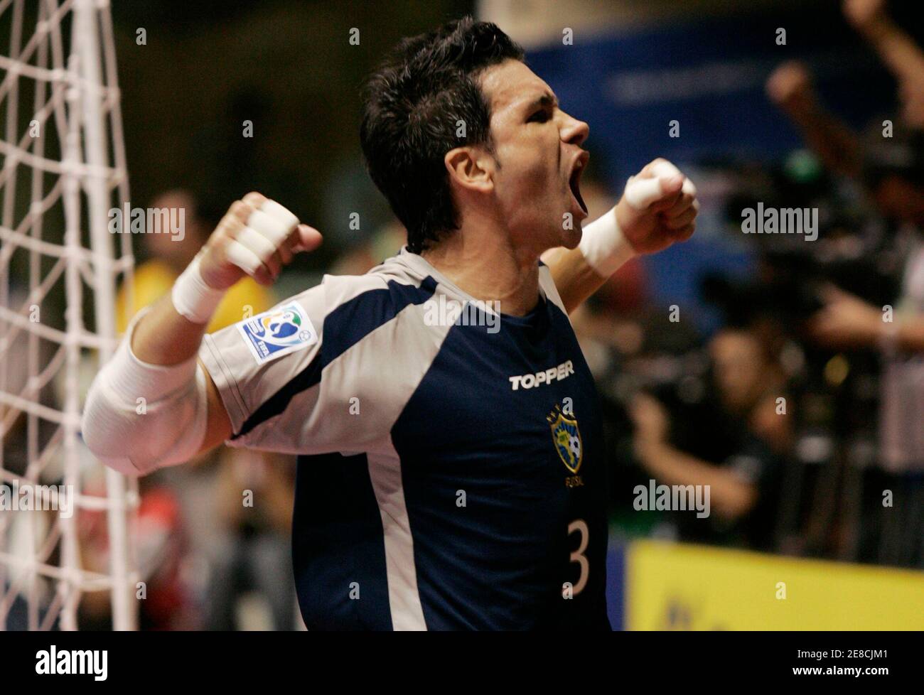 Franklin of Brazil celebrates after winning the FIFA Futsal World Cup soccer  match against Spain at the Gimnasio Maracanazinho in Rio de Janeiro October  19, 2008. REUTERS/Bruno Domingos (BRAZIL Stock Photo - Alamy