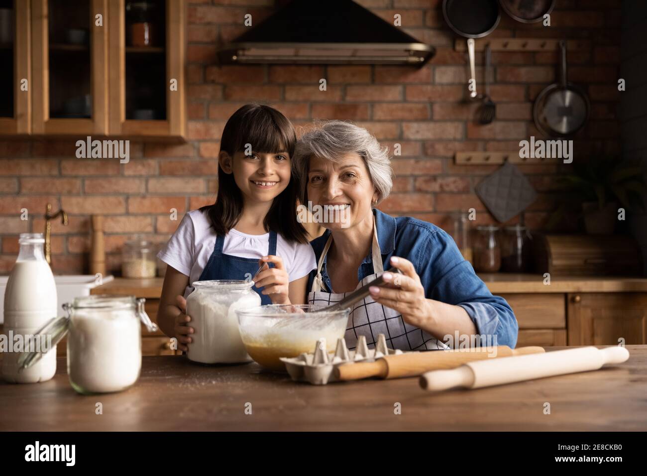 Head Shot Portrait Smiling Grandmother With Little Granddaughter 