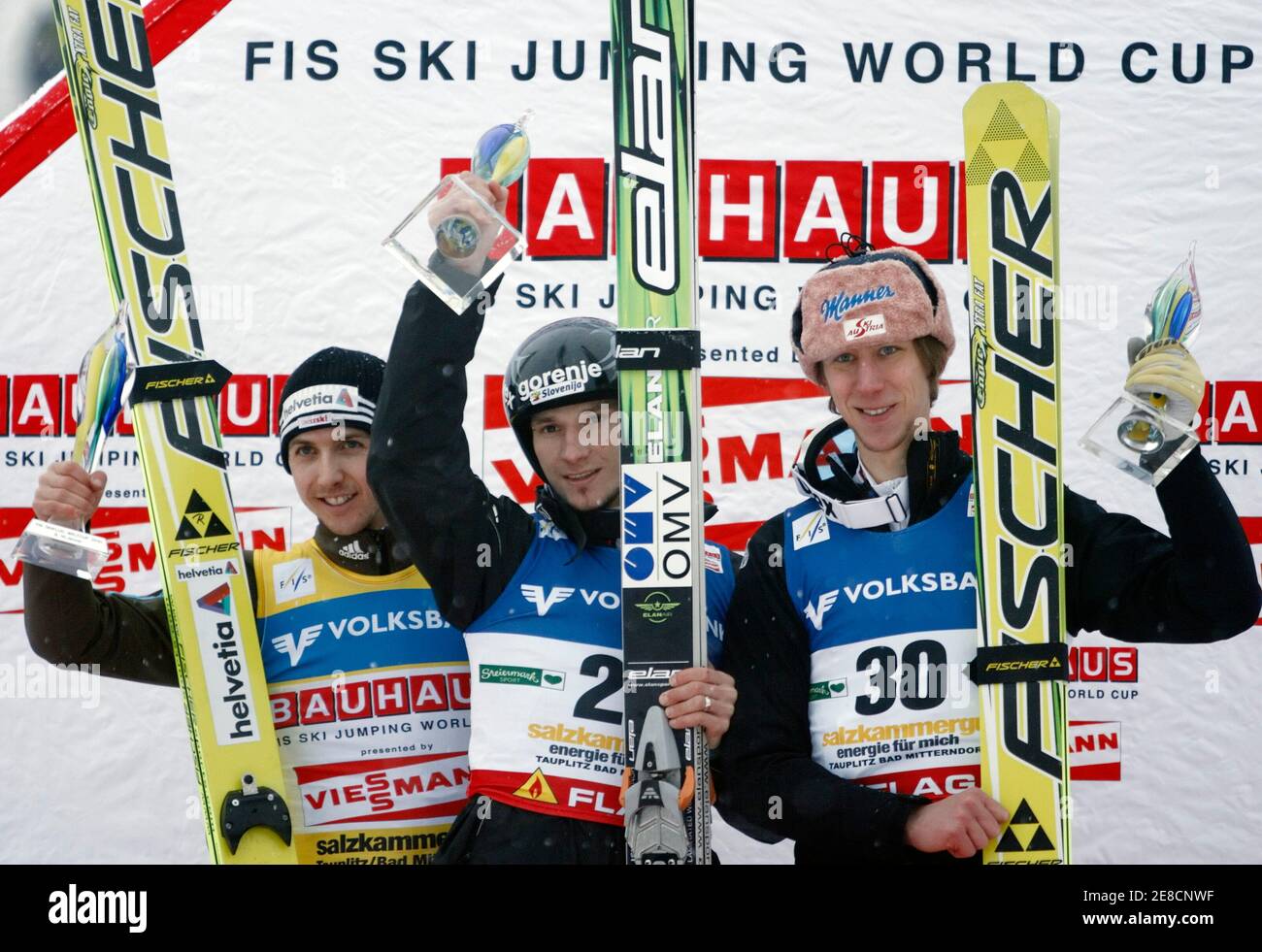 Simon Amman of Switzerland, Robert Kranjec of Slovenia and Martin Koch of  Austria (L-R) stand on the podium after a ski jumping World Cup in Bad  Mitterndorf January 9, 2010. REUTERS/Heinz-Peter Bader (