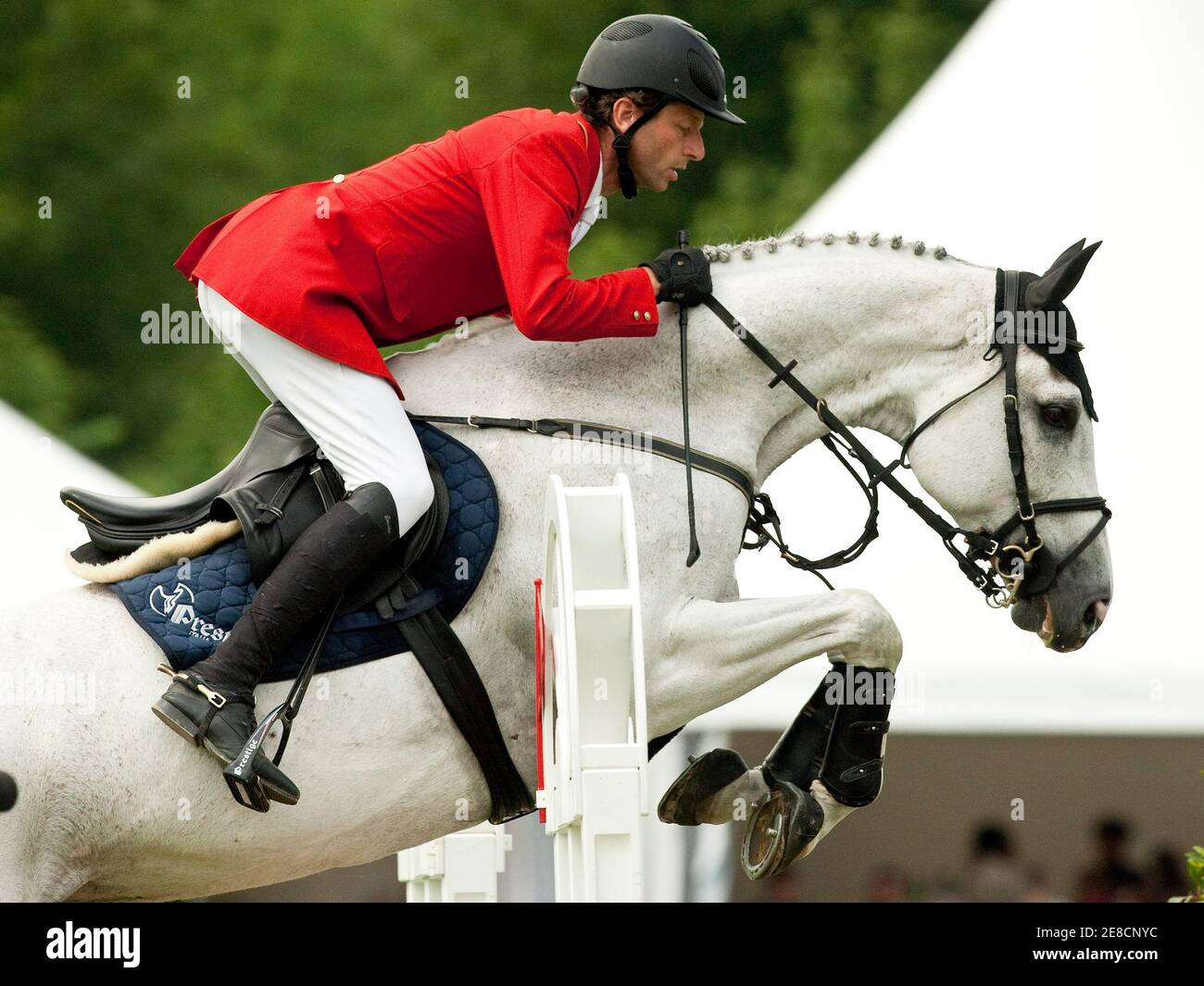 Carsten-Otto Nagel of Germany riding his horse Corradina clears a jump  during the CSIO Grand Prix of Switzerland in St. Gallen June 6, 2010.  REUTERS/Miro Kuzmanovic (SWITZERLAND - Tags: SPORT EQUESTRIANISM Stock