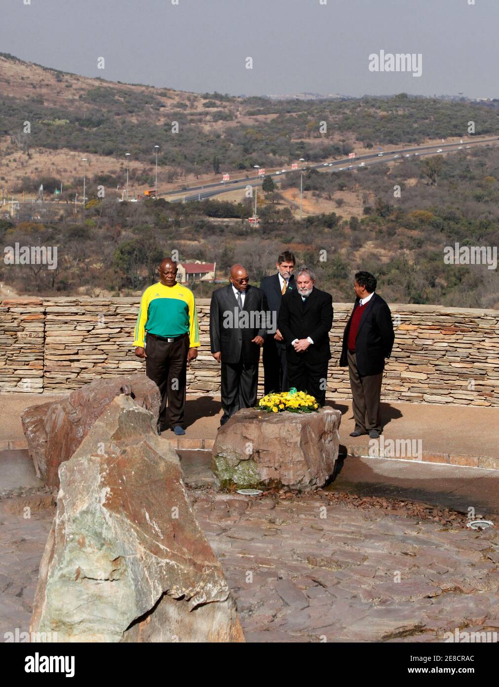 Brazil's President Luiz Inacio Lula Da Silva (2nd R) and South Africa's President Jacob Zuma (2ndL) pay respects at the Isivivane Memorial in the Freedom Park in Pretoria July 9, 2010. REUTERS/Thomas Mukoya (SOUTH AFRICA - Tags: SPORT SOCCER WORLD CUP POLITICS) Stock Photo