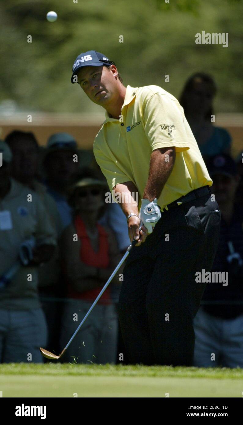Chris DiMarco of the U.S. plays his ball at the 8th hole during the third round of the $4 million Sun City Golf Challenge in Sun City, west of Johannesburg, in South Africa December 3, 2005. REUTERS/Juda Ngwenya Stock Photo