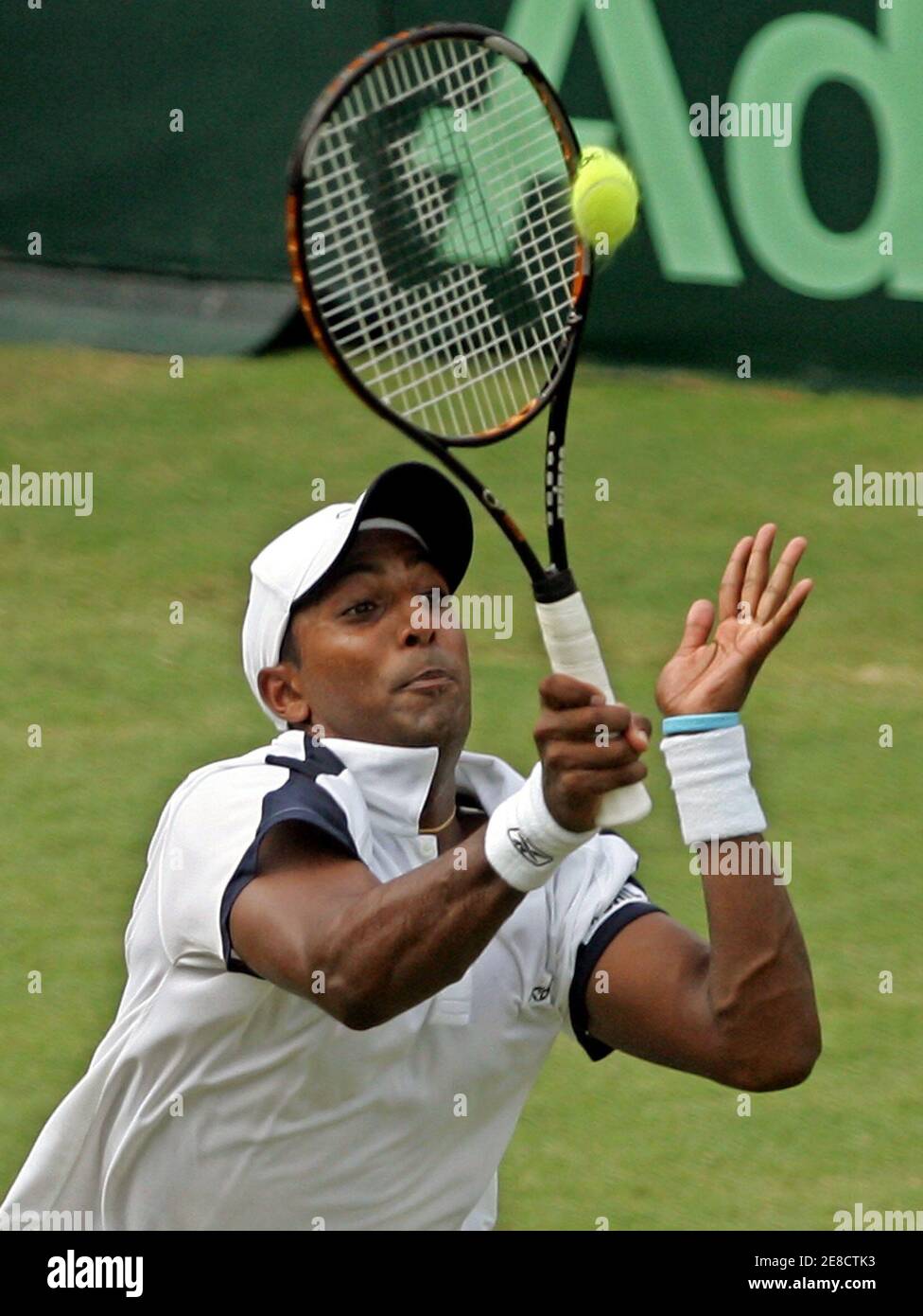 Indian tennis player Prakash Amritraj returns the ball to Jonas Bjorkman of  Sweden, world's top doubles player, in the first singles of the Davis cup  in New Delhi September 23, 2005. World